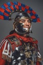 Headshot of on gray roman warrior with plumed helmet