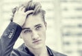 Headshot of handsome blond young man outdoor in city Royalty Free Stock Photo