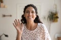 Headshot of happy young woman look at camera waving Royalty Free Stock Photo