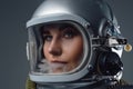 Headshot of modern spacewoman dressed in spacesuit