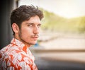 Headshot of one handsome young man in urban setting Royalty Free Stock Photo