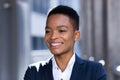 Headshot photo with close up portrait of young successful business woman, african american woman smiling and rejoicing looking at Royalty Free Stock Photo