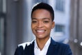 Headshot photo with close up portrait of young successful business woman, african american woman smiling and rejoicing looking at Royalty Free Stock Photo