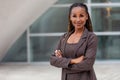 Headshot portrait of an african american female business executive in a suit outside the office workplace Royalty Free Stock Photo