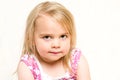 Headshot Portrait of Beautiful Toddler Girl with Mischevious Expression Royalty Free Stock Photo