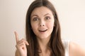 Headshot portrait of excited woman with great idea