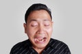 Funny Asian Man Crying Royalty Free Stock Photo