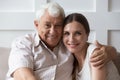 Headshot portrait of happy adult dad and daughter hugging Royalty Free Stock Photo