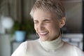 Headshot portrait of happy business woman smiling with closed eyes Royalty Free Stock Photo