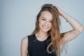 Headshot Portrait of happy girl with beauty face smiling looking at camera. Smiling student girl wearing casual dress. Royalty Free Stock Photo