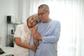 Headshot portrait of happy mature Caucasian grey-haired couple husband and wife hug show love and care