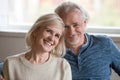 Headshot portrait of happy middle aged romantic couple posing in Royalty Free Stock Photo