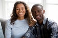 Portrait of happy mixed race couple posing for picture Royalty Free Stock Photo