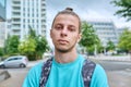 Portrait of handsome hipster guy outdoor, on city street Royalty Free Stock Photo