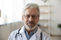 Headshot portrait of mature Caucasian male doctor in uniform Royalty Free Stock Photo