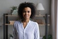 Headshot portrait of smiling African American woman posing Royalty Free Stock Photo