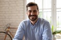 Headshot portrait of smiling Caucasian male employee posing in office Royalty Free Stock Photo