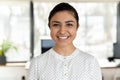 Headshot portrait of smiling indian female employee posing Royalty Free Stock Photo
