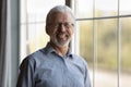 Headshot portrait of smiling old man pose indoors Royalty Free Stock Photo