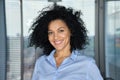 Headshot portrait of stylish African American businesswoman in modern office. Royalty Free Stock Photo