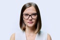Headshot portrait of young beautiful woman in glasses, on white studio background Royalty Free Stock Photo