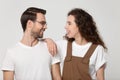 Headshot portrait young happy couple looking at each other. Royalty Free Stock Photo