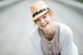 Headshot portrait of young happy woman laughing outdoors Royalty Free Stock Photo