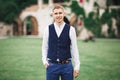 Headshot portrait of young man smiling  on outside outdoors background Royalty Free Stock Photo