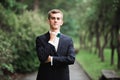 Headshot portrait of young man smiling isolated on outside outdoors background Royalty Free Stock Photo