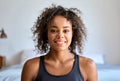 Headshot portrait of young mixed raced woman looking at camera indoors. Royalty Free Stock Photo