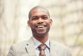 Headshot portrait of young professional man smiling laughing