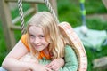 Headshot of pretty young blonde girl making eye contact and smiling Royalty Free Stock Photo