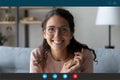 Headshot of smiling female talk on video call at home