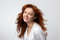 Headshot Of Smiling Red-Haired Young Female Over Gray Background Royalty Free Stock Photo