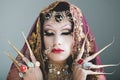 Headshot woman dressed in traditional hindu clothing, heavily decorated in gold and elegant veil, extremely long