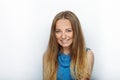 Headshot of young adorable blonde woman with cute smile on white background