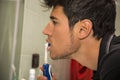 Headshot of young man brushing teeth with Royalty Free Stock Photo