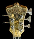 Headstock Close Up and Tuning Gears of a Buckeye Burl Wood Five String Electric Bass Guitar Royalty Free Stock Photo