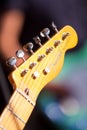 Headstock with frets, neck and fretboard of old classic legendary solo guitar Fender Telecaster at rehearsal