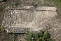 A headstone lays in the abandoned cemetery adjacent to Ishak Pasa Palace at Dogubayazit