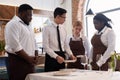 Headwaiter Teaching New Employees Royalty Free Stock Photo