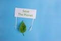 Heal the world - environment protection.leaf holding a banner Royalty Free Stock Photo