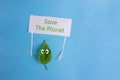 Heal the world - environment protection.leaf holding a banner Royalty Free Stock Photo