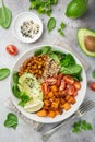 healhty vegan lunch bowl. Avocado, quinoa, sweet potato, tomato, spinach and chickpeas vegetables salad Royalty Free Stock Photo