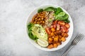 healhty vegan lunch bowl. Avocado, quinoa, sweet potato, tomato, spinach and chickpeas vegetables salad Royalty Free Stock Photo