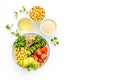 Healthy vegan lunch bowl. Avocado, quinoa, sweet potato, tomato, spinach and chickpeas vegetables salad on white table Royalty Free Stock Photo