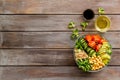 Healhty vegan lunch bowl. Avocado, quinoa, sweet potato, tomato, spinach and chickpeas vegetables salad on wooden table Royalty Free Stock Photo