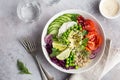 Healhty vegan lunch bowl. Avocado, quinoa, tomato, cucumber, red