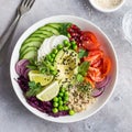 Healhty vegan lunch bowl. Avocado, quinoa, tomato, cucumber, red