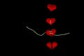 Healing broken heart concept red heart is sewn with white thread with needle on black background